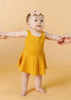 Kortni Jeane Ribbed Golden | Baby Skirted One-Piece RibbedGolden Best